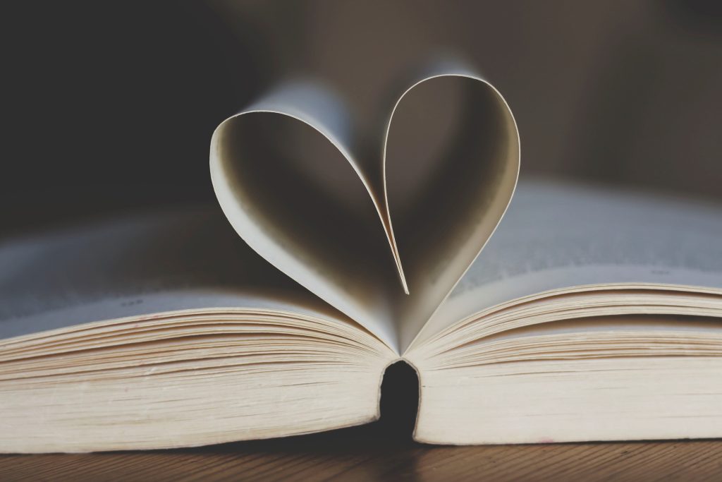 Open book with pages shaped into a heart.